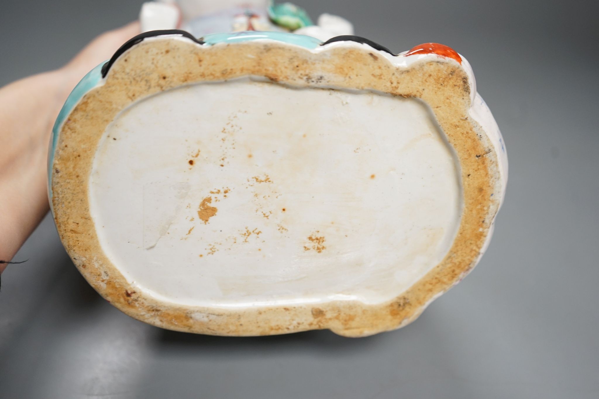 A large Chinese enamelled porcelain boys group, 31cm